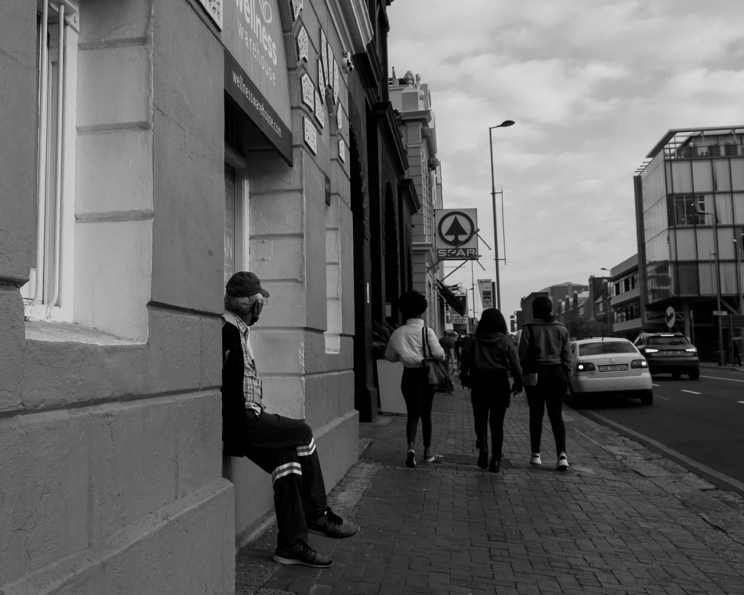 Man photographed in Cape Town Watchng people walk by