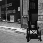 Photo of a wheel chair outside a laundromat